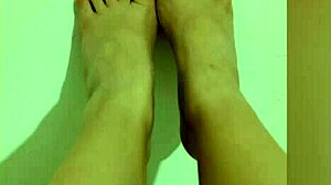 Shy petite hottie feels horny showing off her sexy legs and red pedicure on camera