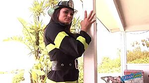 Naughty female firefighter teases with hot outdoor striptease.