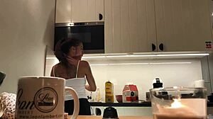 Spying on Sylvia's perfect nipples in the kitchen.