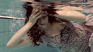 Loris Licicia shows off her petite figure in a hot underwater naked swim