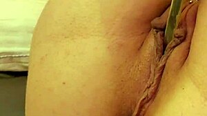 Teen with piercing and tattoo puts knives in her holes in bdsm scene.