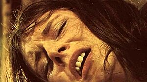 Vintage dark London scene with rope bondage from the swinging sixties era.