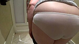hidden cam catches mature chubby milf trying shorts in fitting room