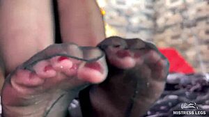 Hey, look at this goddess teasing with cute black pantyhose on her feet!