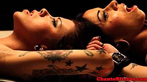 Mistress dominates her submissives in a lesbian bdsm session