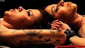 Mistress dominates her submissives in a lesbian bdsm session