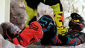 Motocross Rider In Costume Treads Boots In Gay Scene