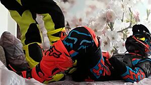 Motocross Rider In Costume Treads Boots In Gay Scene