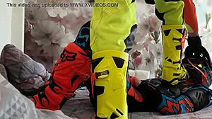 Motocross Rider In Costume Treads Boots In Gay Scene