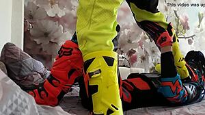 Motocross Rider In Costume Treads Boots In Gay Scene