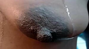 ebony girl with saggy tits and big long nipples on webcam