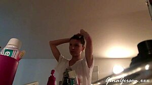 young blonde teen gives footjob in home video, stroking with pretty feet