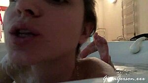 young blonde teen gives footjob in home video, stroking with pretty feet