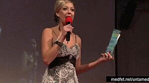 Female and male strippers perform teasing dance for audience