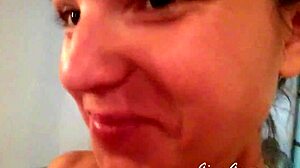 young blonde teen gives footjob in home video, stroking with pretty feet