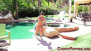 Brunette teen 18+ in bikini subtly showing off her enticing tits outdoors.