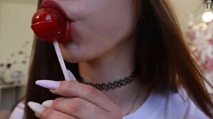 nothing unusual, just a girl sucking on a lollipop while clothed