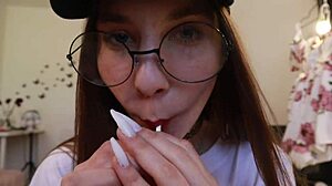 nothing unusual, just a girl sucking on a lollipop while clothed