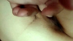 he plays with his wife's pussy, fingering her while she masturbates