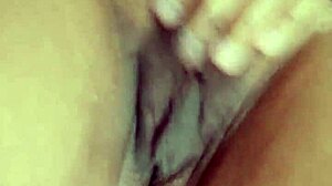 Sexy morena masturbates her hairy vagina with intense passion in close-up view.