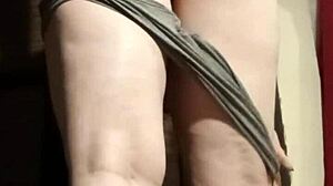 Busty camgirl in grey gently fingers her ass