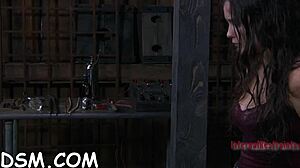 Cheerful Brunette Darling Is Playing With Her Rubber Sex Toy While In BDSM Gear And Masturbating