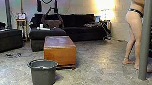 Horny gay nudist cleans house barefoot on beach while masturbating with anal toys