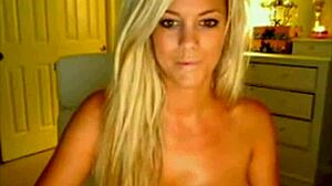 Hot busty blonde dances and strips on webcam, ripping clothes off.