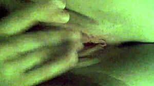 Girlfriend fingers her wet shaved pussy to orgasm.