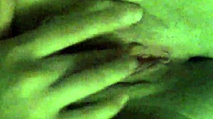 Girlfriend fingers her wet shaved pussy to orgasm.