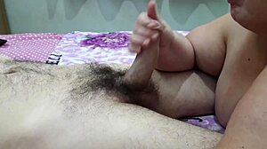 Awesome handjob from amateur wife! She strokes her husband's cock so passionately at home!