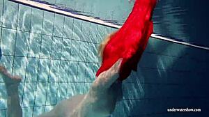 Russian teen Lucie swims underwater in the pool