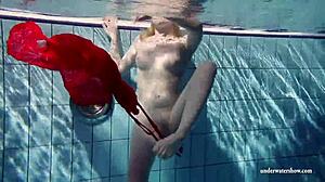 Russian teen Lucie swims underwater in the pool