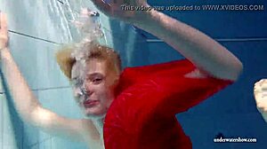 Russian teen Lucie swims underwater in the pool
