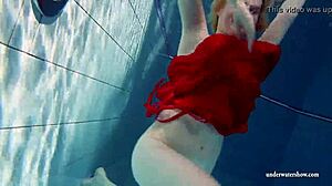 Russian teen Lucie swims underwater in the pool