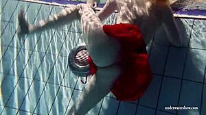 Russian teen Lucie swims underwater in the pool