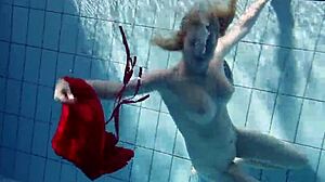 Russian teen Lucie swims underwater in the pool