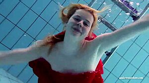 Russian teen Lucie swims underwater in the pool