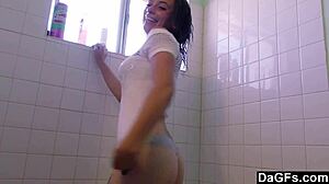 Very attractive teen strips and pleasures herself in bathroom solo.