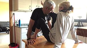 love in the kitchen with mature blonde couple