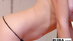 Busty Brett teases pussy in red high heels