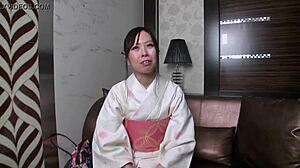 Bathrobe-Clad Mature Woman Engages in Intimate Encounter