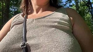 This milf is flashing her tits in the park