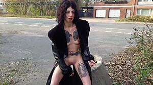 Look At That Whore Pissing And Masturbating On The Public Street!