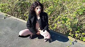 Look At That Whore Pissing And Masturbating On The Public Street!