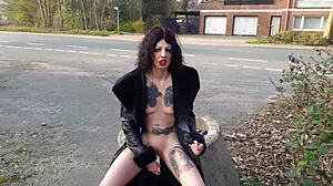 Look At That Whore Pissing And Masturbating On The Public Street!