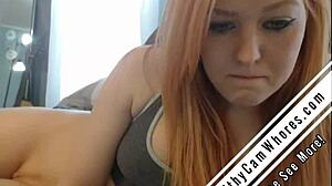 Watch redhead tease pussy with dildo?