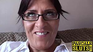 Busty milf Amber masturbates on sofa