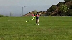 Teen Little April rubs clit outdoors while sucking popsicle