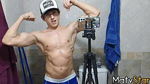 Watch this cute twink flex muscles and cum in the bathroom